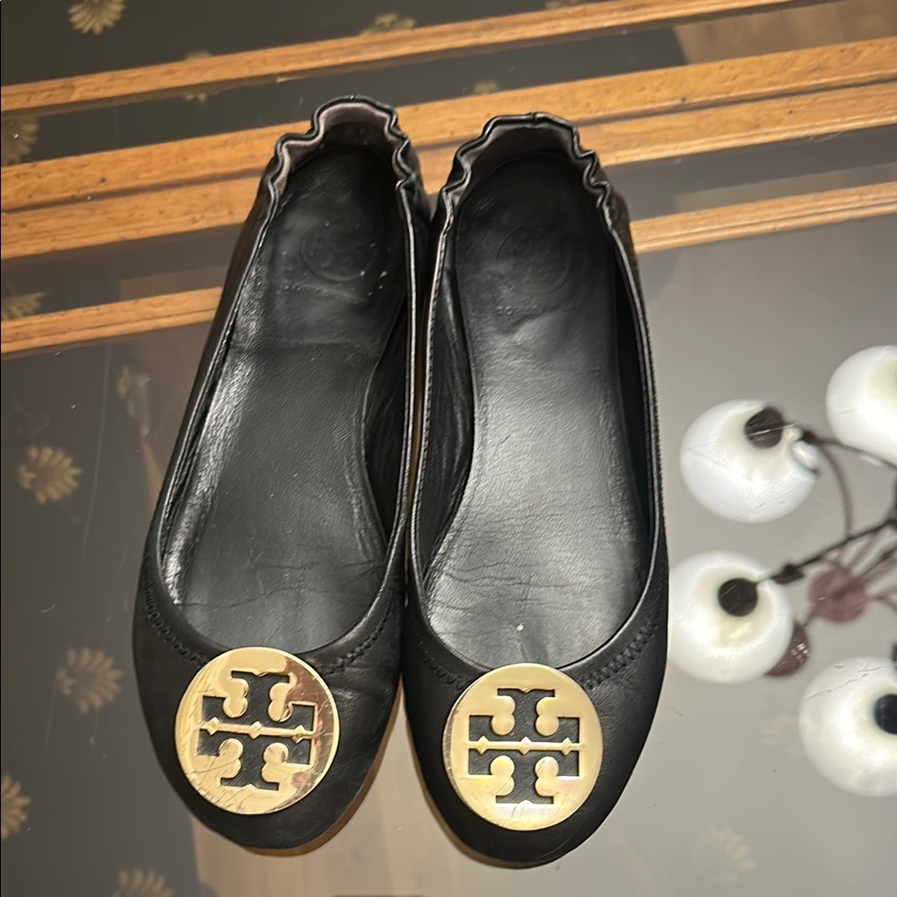Tory Burch Black Flats with Gold Emblem